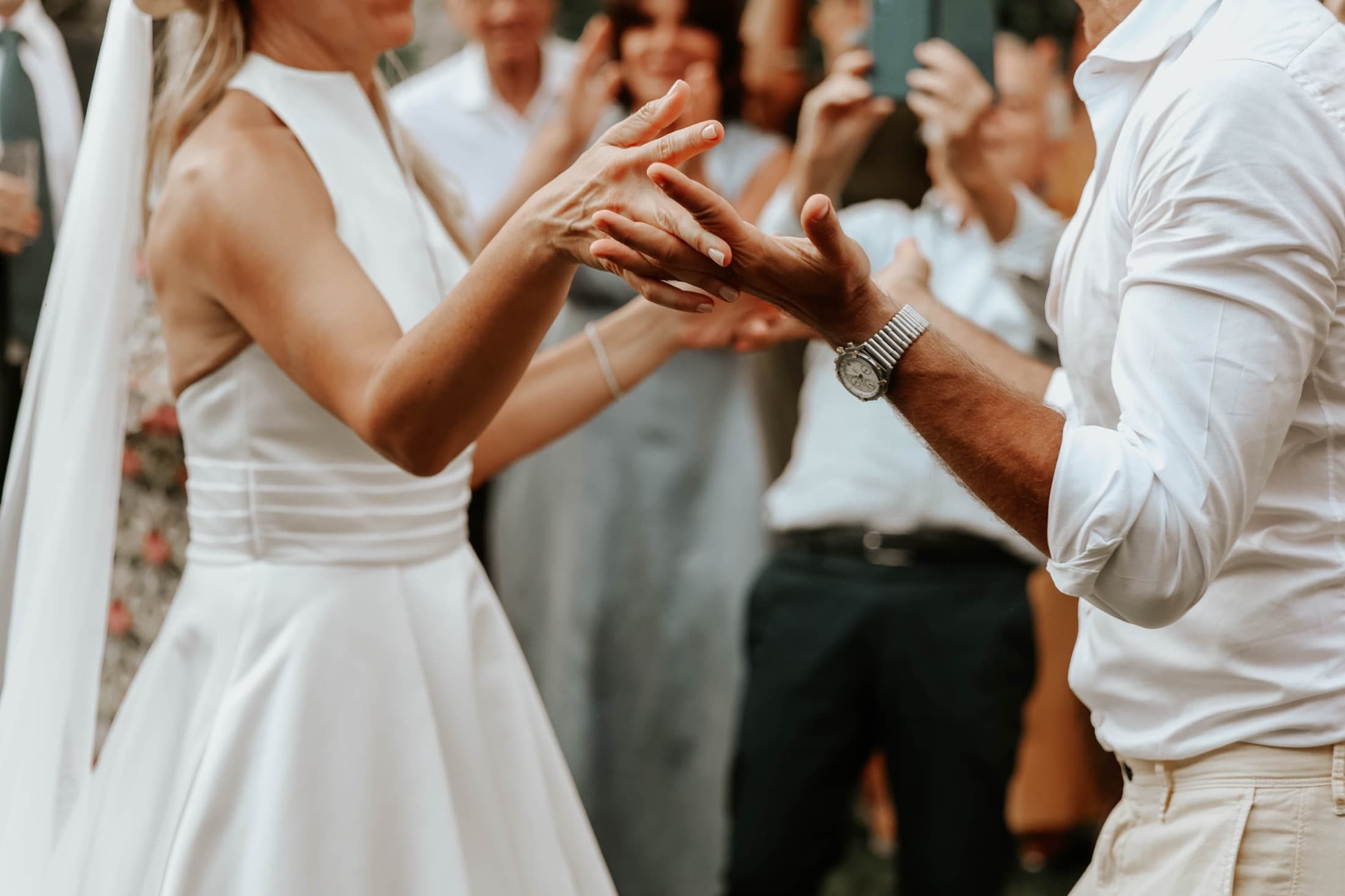 Couple holding hands during their vows